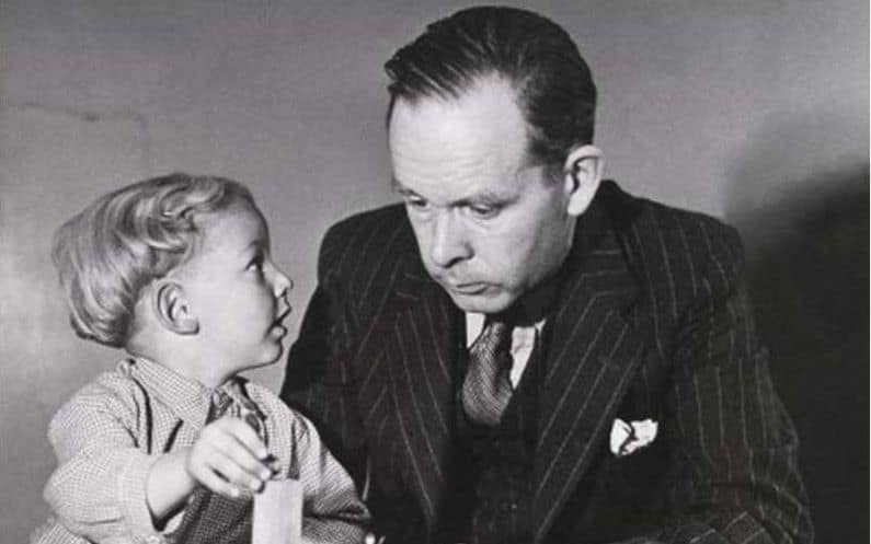 The black and white picture shows John Bowlby playing with a child. Bowlby developed the Attachment Theory stressing out the importance of strong relationship between the child and the mother. His research is used in the treatment 0f traumatized children