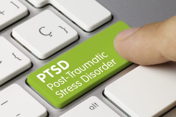 Treatment for PTSD in Dubai. The picture shows a computer keyboard. On one button the word. PTSD is engraved 