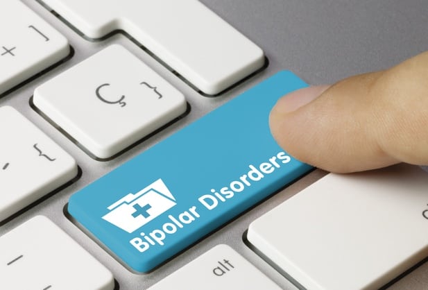 PC keyboard with a button and inscription "bipolar disorder"