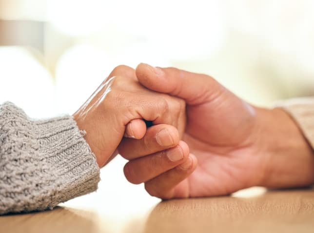 Marriage counselling in Dubai. Couple's hands holding each other